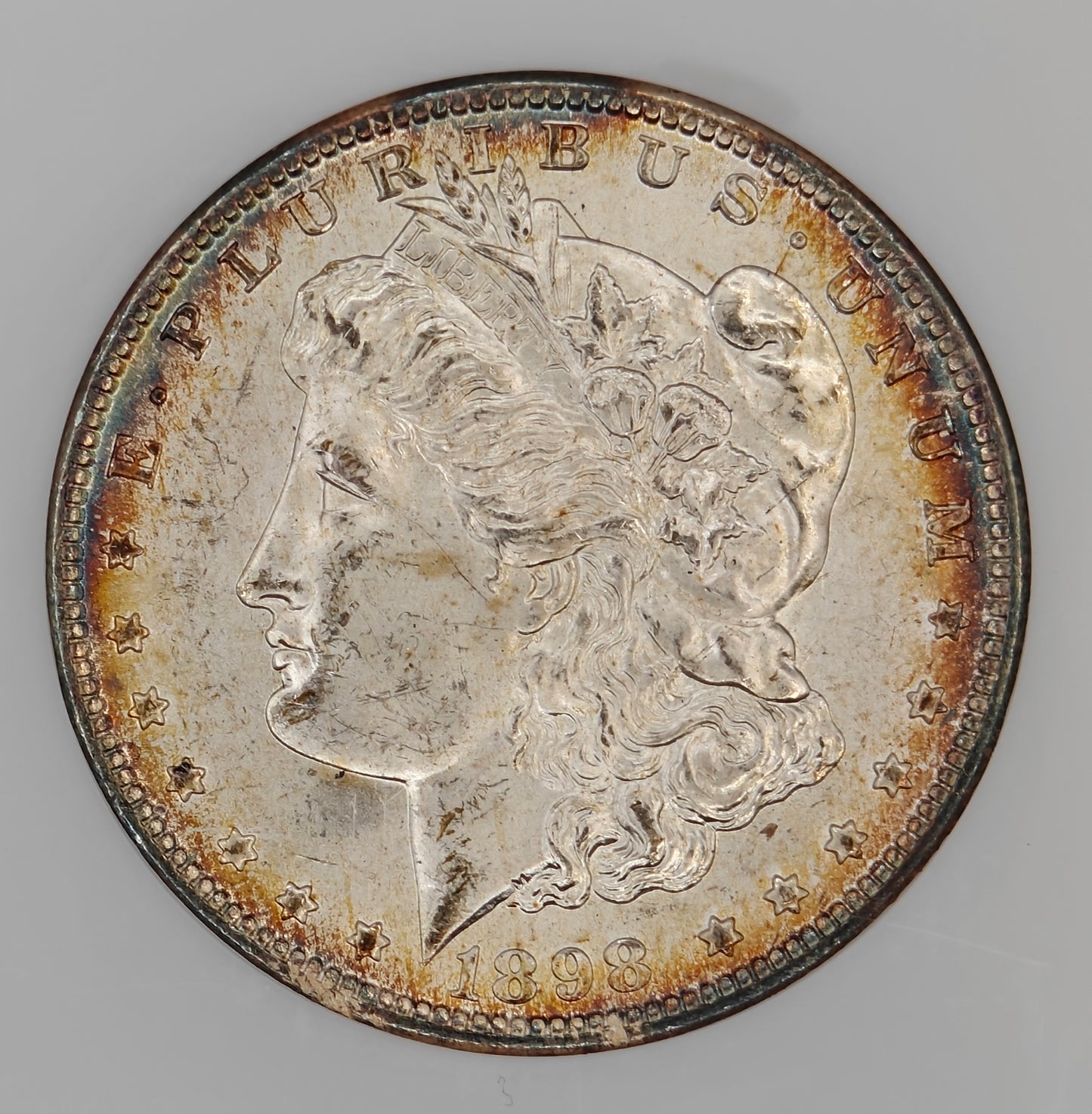 1898-O Morgan Dollar MS-64 NGC (Beautiful Toning)
