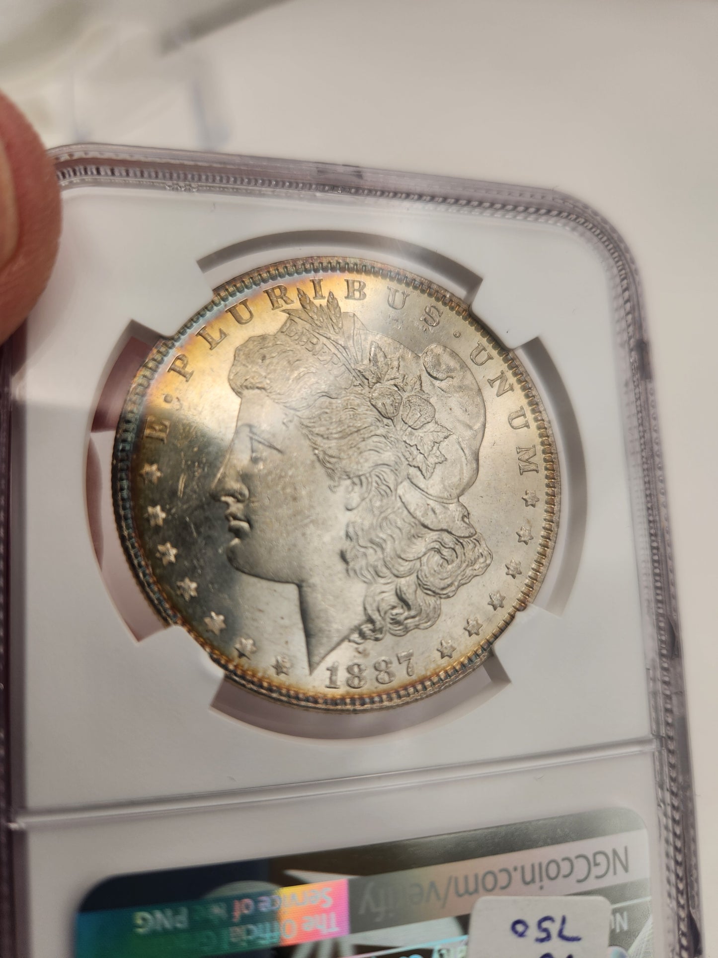 1887 Morgan Dollar MS-63 NGC (DPL, Beautiful Toning)